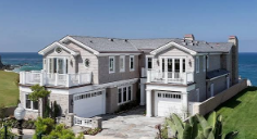 Light blue Isle of Palms beach house with palmetto trees for a bachelorette weekend